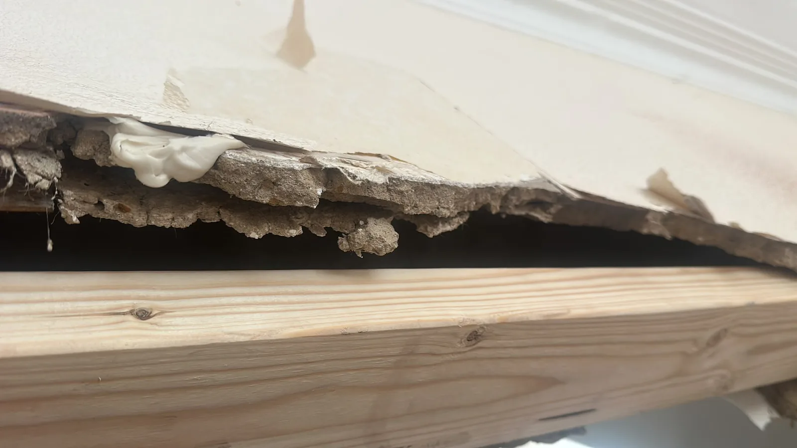 Damaged ceiling material opened up during residential strip out work