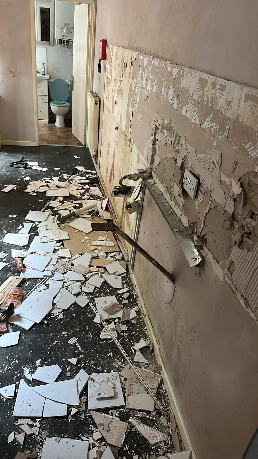Kitchen wall tiles and finishes removed during an internal strip out