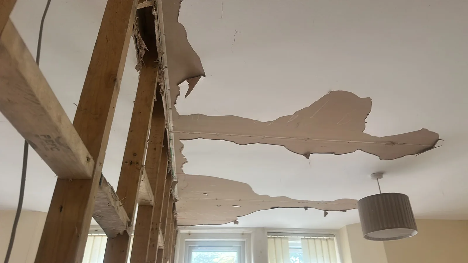 Ceiling finishes being removed during an internal residential strip out