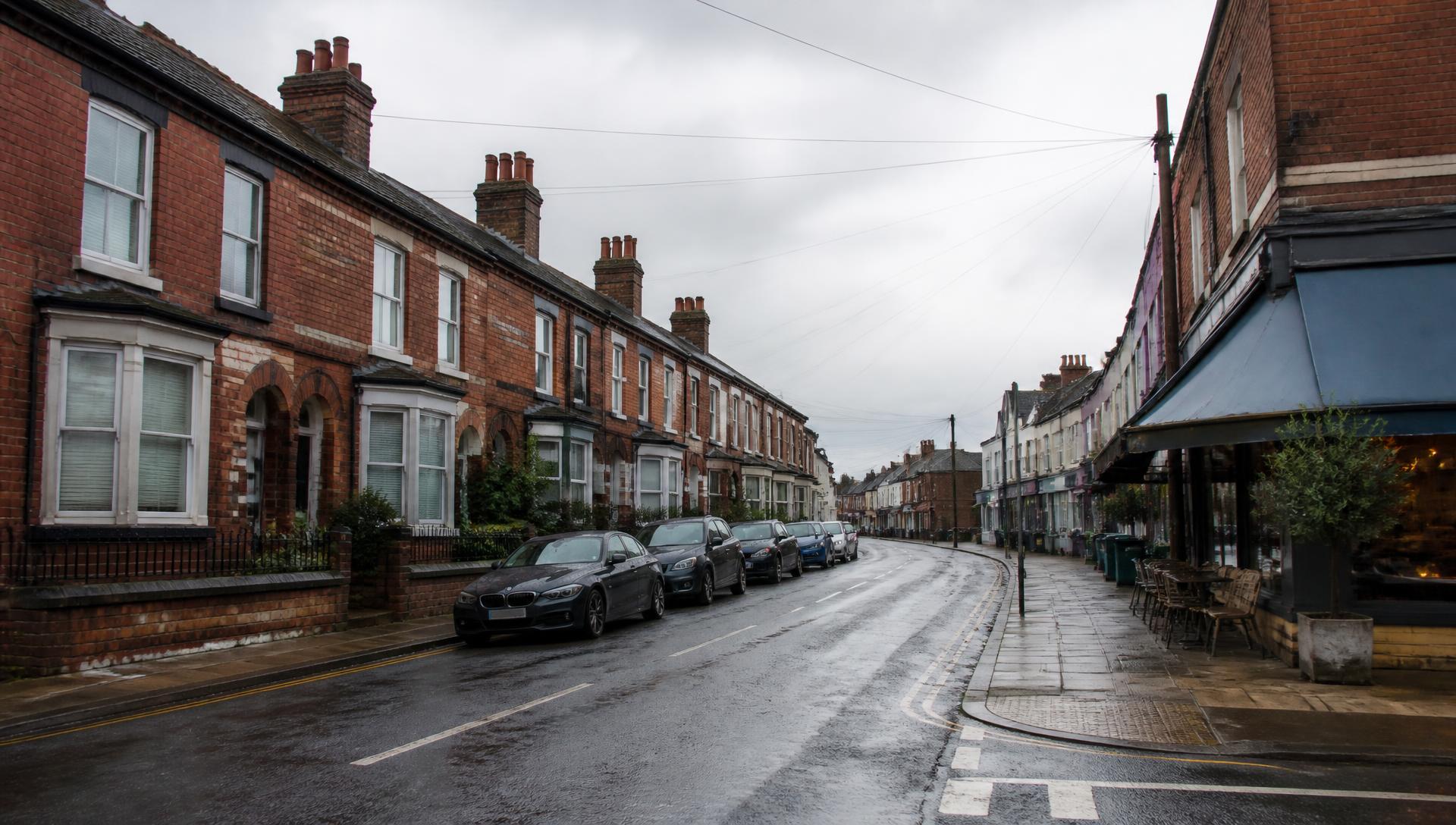 Liverpool street of red-brick terraced houses, semi-detached homes and small retail units